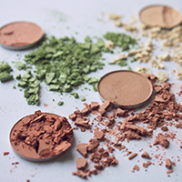 Image of cosmetic compacts with broken powder